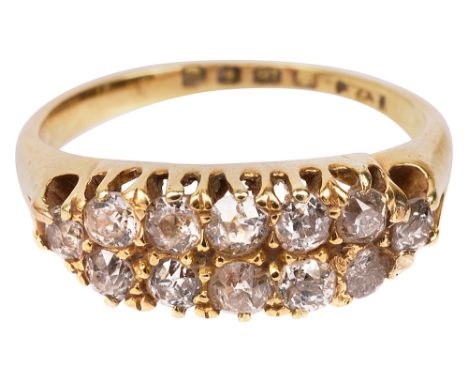 A late Victorian two row diamond-set ring, set with 12 old-cut diamonds to the 18ct yellow gold pierced gallery and plain sha