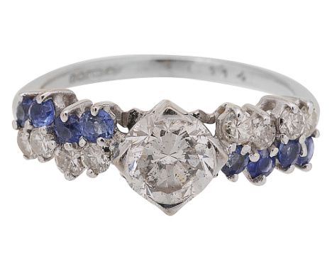 A diamond and sapphire-set ring, the central brilliant-cut diamond  claw-set above a row of brilliant-cut diamonds and circul