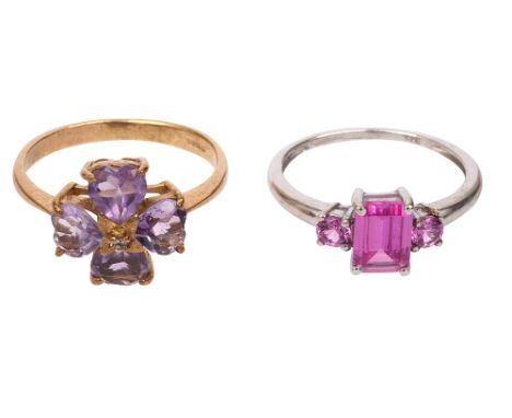 An amethyst ring, composed of four heart-shaped amethyst to a diamond-set centre, the  9ct yellow gold plain shank with  Birm