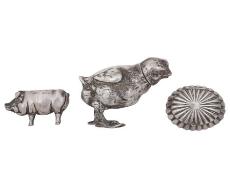 A German novelty .800 naturalistic silver chick pepper pot, an Edwardian small novelty pig pincushion and a pill boxfirst sta