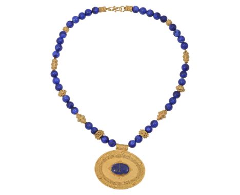 A lapis lazuli and pendant medallion necklace,the lapis beads (untested) with various ornate spacers suspending an oval engra