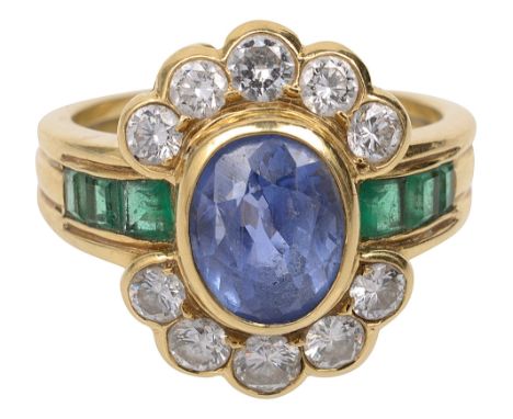 A sapphire, diamond, emerald and 18ct yellow gold ring, the central oval mixed-cut sapphire collet with a line of five brilli