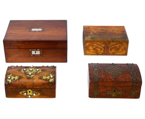 A Victorian amboyna domed box with brass mounts a similar walnut box  and an Arts and Crafts poker work box and an early Vict