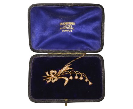 An Edwardian 15ct yellow gold and pearl floral spray brooch, the tied lily of the valley (convallaria majalis) bouquet set wi