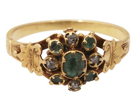 An early 19th century yellow gold, emerald and diamond ringthe central cluster centrally-set with an oval emerald collet with