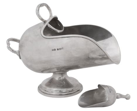 A George V novelty silver sugar scuttle and scoopBirmingham, 1927 by Charles Wealeof plain design with two foliate  chased ha