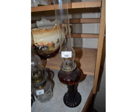 SMALL OIL LAMP WITH COLOURED GLASS BASE