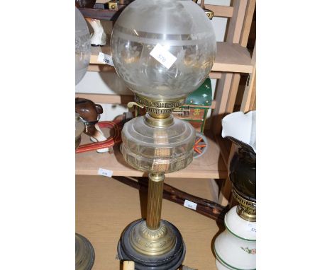 BRASS BASED OIL LAMP WITH CLEAR GLASS FONT AND FROSTED GLASS SHADE
