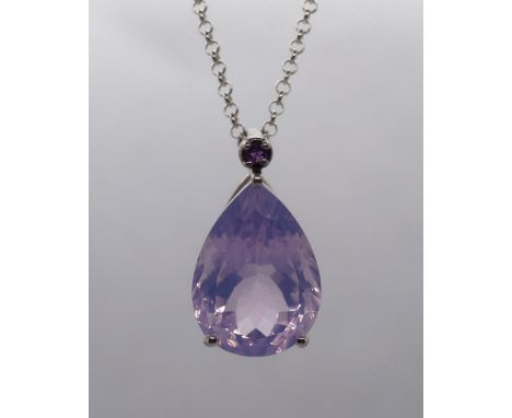 Silver and amethyst pendant on chain 