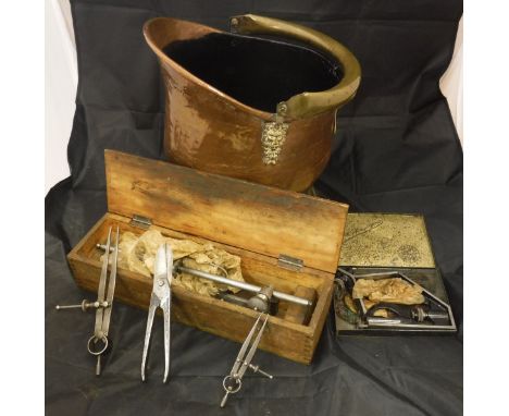 A box containing assorted tools and tooling to include a micrometer stamped "A Boucher" and no'd 965 to the body, together wi