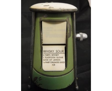 A vintage metal and enamel decorated cocktail recipe holder with ivorine panels, each inscribed with a different cocktail to 