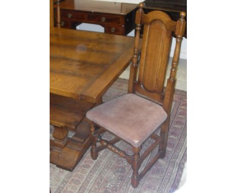 A Gateway Antiques oak refectory style dining table, the plank top with cleated ends on end pillar supports to splayed feet u