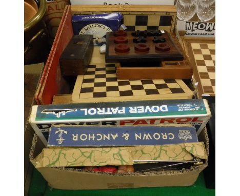 A box of assorted games to include a cased set of double nine dominoes, various chess sets, together with a box of books on g