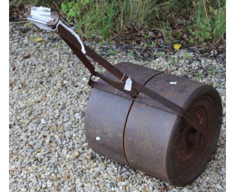 A cast iron garden roller