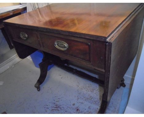 A 19th Century mahogany two drawer sofa table on end pillar supports united by a centre stretcher, together with a 19th Centu