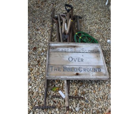 A selection of long handled garden tools