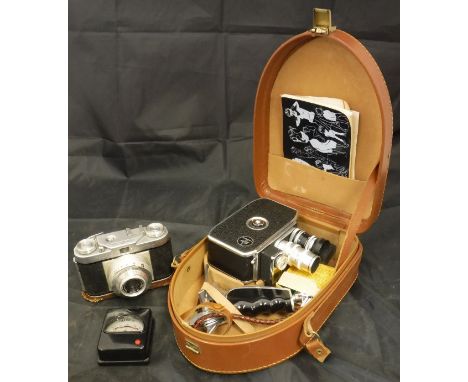 A box of various cameras and camera equipment to include a Bolex Paillard B8L 8mm cine camera housed in leather carry case et