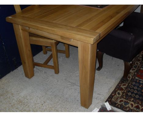 A light oak extending rectangular dining table on square section legs, together with three ladder back dining chairs   CONDIT