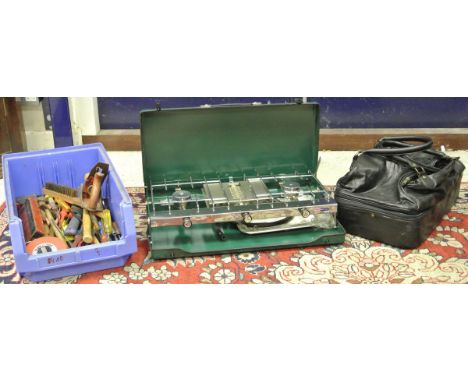 A collection of assorted hand tools, together with a Tilly gas stove, a yoke and a black leather holdall