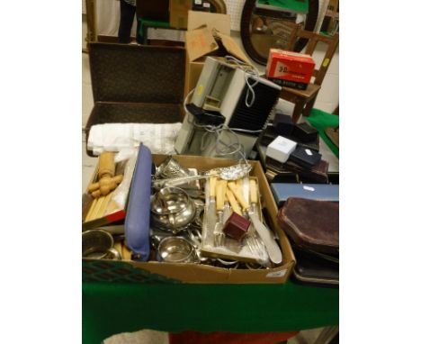 A box of assorted plated cutlery etc together with a modern upholstered foot stool, a projector, leather suitcase and a minia