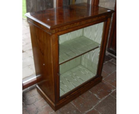 A burr walnut single door glazed door cabinet enclosing two shelves with fluted pilasters to a plinth base   CONDITION REPORT