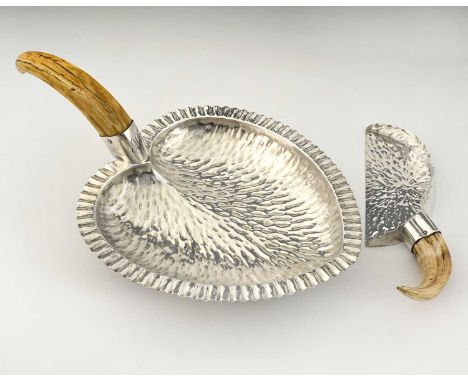 Hukin and Heath, a plated serving tray, of hearth-shaped form, the body with textured decoration, and boar's tusk handle, the