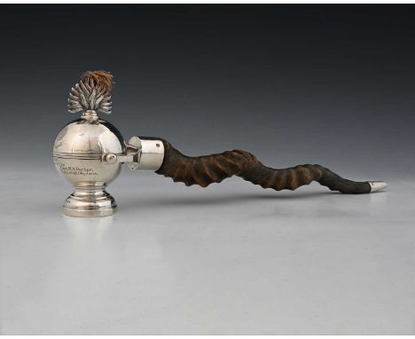 A Regimental table lighter in the form of a flaming grenade, the whole pivoted on a silver-mounted horn handle, Sheffield 193