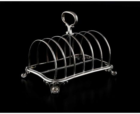 A Victorian silver seven-bar toast rack, atop four cast and applied scroll-form feet, the underside inscribed, 'Hunt &amp; Ro