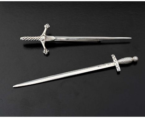 A Victorian silver novelty letter opener, modelled in the form of a sword, London 1865, Henry Holland, length 15.1cm, togethe