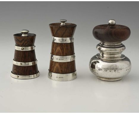 Hukin and Heath, an Edwardian wood and silver pepper grinder, Birmingham 1909, height 10.5cm, together with a smaller example
