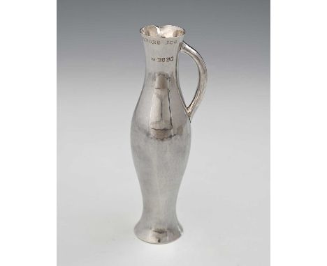 'The Oxford Jug', a Victorian silver slender narrow jug, London 1888, J.N. Mappin, with a weighted base, in imitation of a 14
