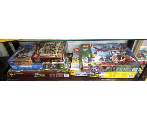 Shelf of boxed Lego sets to include Indiana Jones, Harry Potter etc.