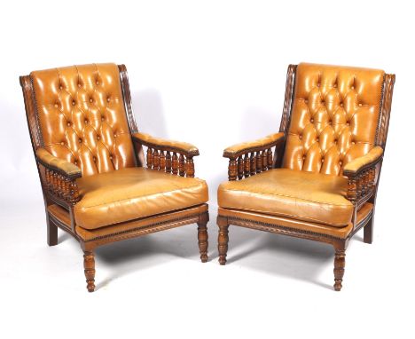 A pair of late Victorian style leather button back style armchairs with tan coloured leather upholstery. H87cm. 