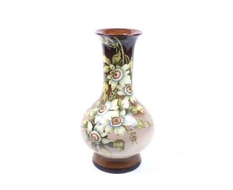 Doulton, Lambeth England : An early hand painted baluster shaped tall vase with passion flowers. Marked under, 43.2 cm high C