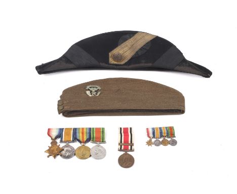 Two military hats and a group of medals. Including a Silberston & Sons 1942 side cap with South Africa 1900-01 badge and a Na