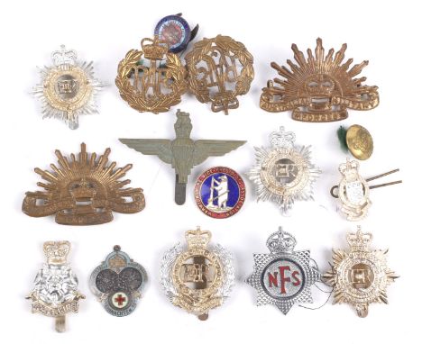 A collection of twelve post-WWII cap badges. Brass and Anodised Aluminum types and an enamel German Red Cross fob, 1915
