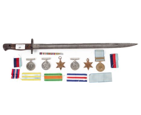 Three WWII medals, 1939-45, two further medals and a bayonet. Comprising the Defense Medal, The France and Germany Star and 1