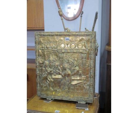 A Brass Stick Stand, with lion mask handles, 54.5cm high, fire irons and dogs.