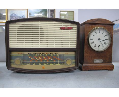 A Vintage Pye Bakelite Radio, together with a 1920's oak mantel clock (2).