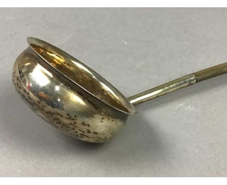 19TH CENTURY TODDY LADLE "L&amp;M"40.5cm long, with a baleen whale bone handle, makers stamp "L&amp;M"