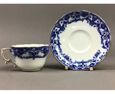 LATE VICTORIAN TEA SERVICE,decorated with foliate and scroll designs in shades of blue on a white ground, comprising twelve c