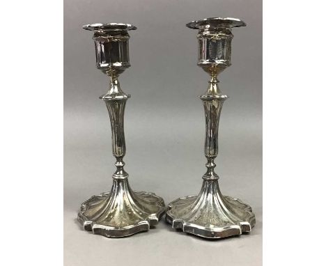 PAIR OF SILVER CANDLESTICKS,along with an egg epergne (3)