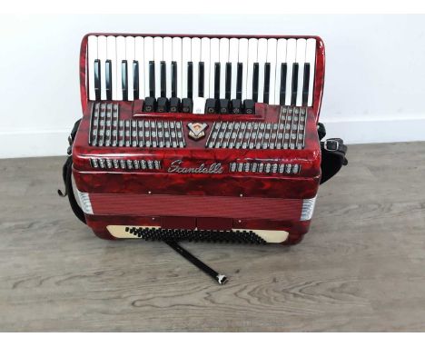 SCANDALLI PIANO ACCORDIAN,in carry caseOn the bottom row of black buttons one is jammed and two are stuck in the down positio