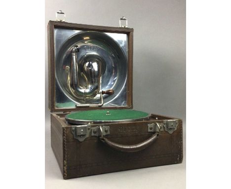 DECCA PORTABLE WIND UP GRAMOPHONE,along with a group of various revolution recordsAt the time of this report the gramophone d