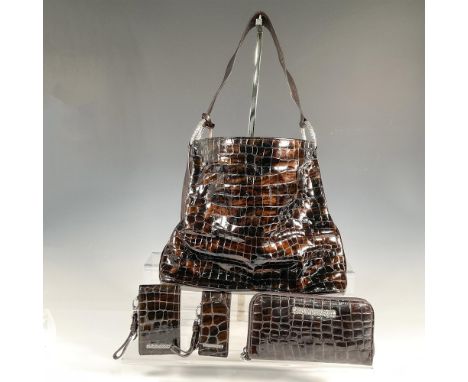 Brown patent leather handbag with interior pockets, zippered closure, silver tone accents; 13"L x 4.25"W x 10.75"H. Length of