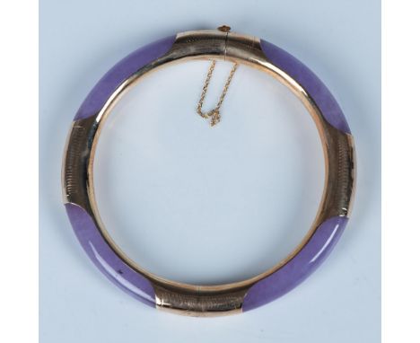 Stunning purple jade with 14k gold. The tab clasp has 14k stamped on it and a safety chain. It measures 2.25" dia. on the ins