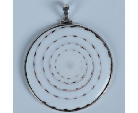 Large round pendant made from shell set in silver metal. Dimensions: 2.25"L x 2"WCondition: Age related wear.