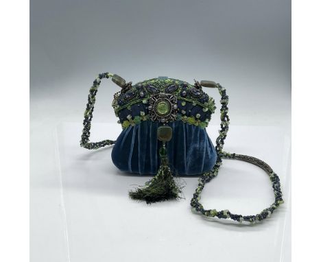 This is a beautiful little evening bag. Covered in gathered blue velvet and satin with a piping of blue and green decorative 