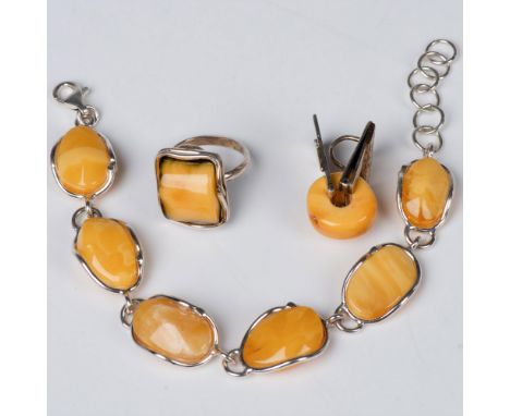 Creamy butterscotch amber artistic edge ring. Rectangular polished stone with a freeform sterling silver edging. The bracelet