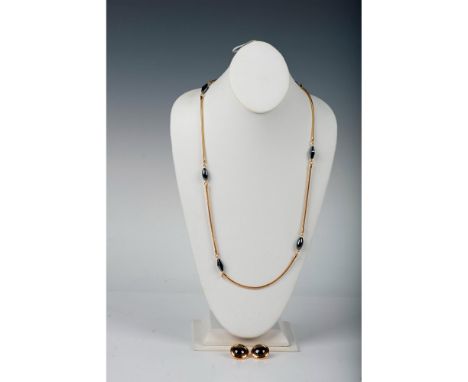 Gold tone necklace with hematite spacers measures 37.5"L. The round clip-on earrings measure 0.75" dia. Stamped Monet. Condit